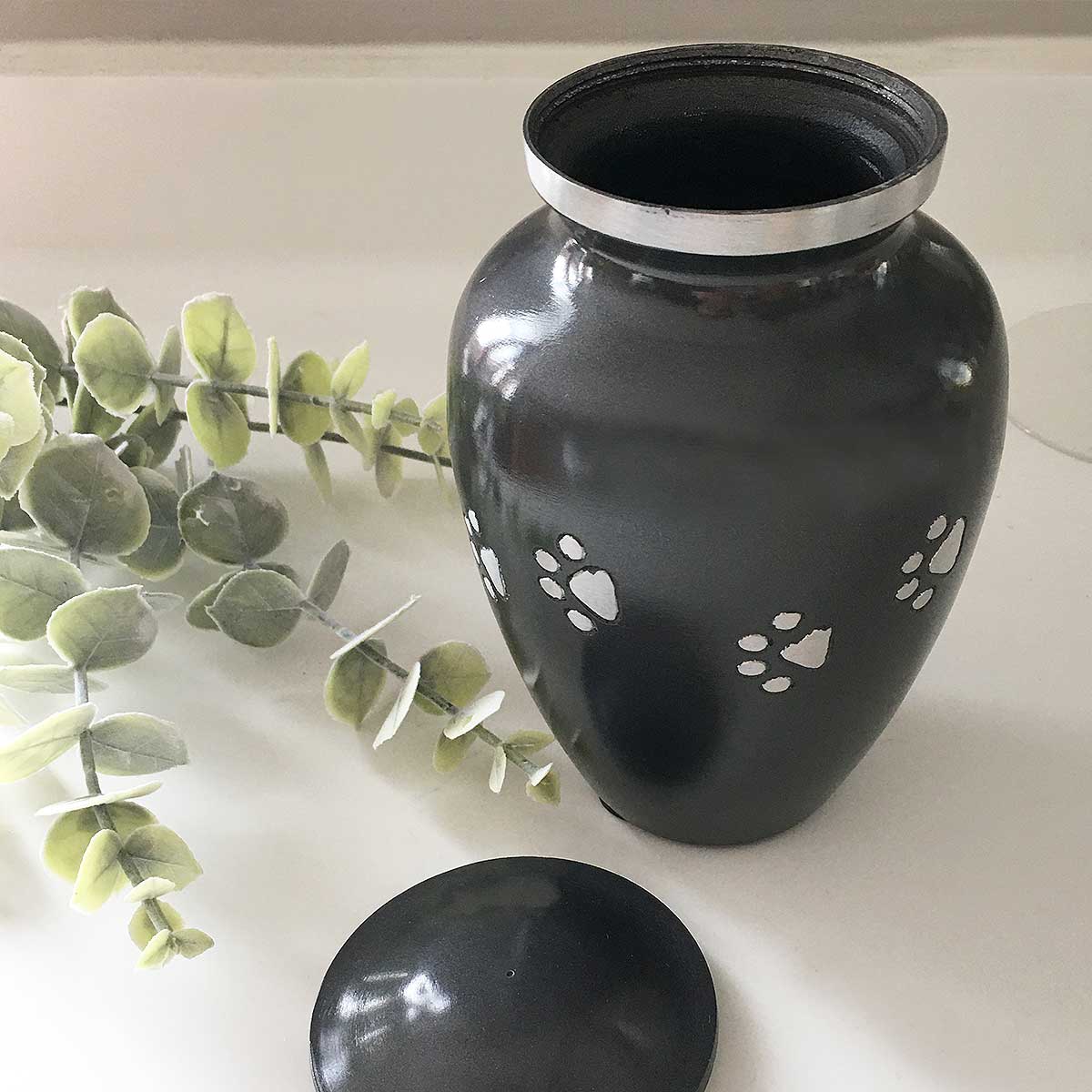 Dog Cremation Urn, Black with a Diamond Cut Silver Paw Print Pattern