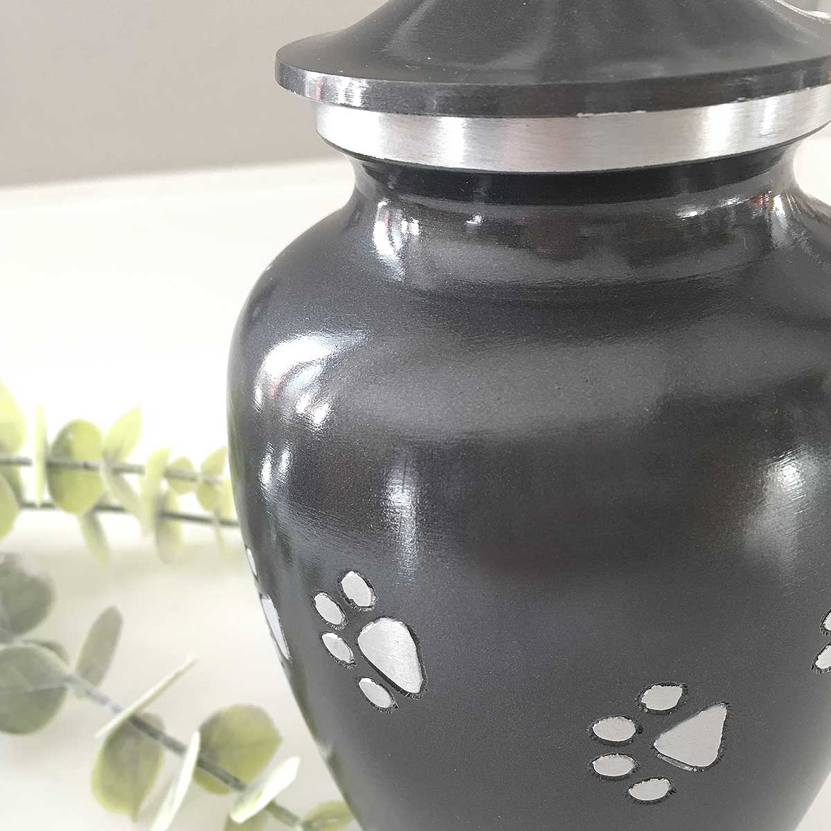 Dog Cremation Urn, Black with a Diamond Cut Silver Paw Print Pattern