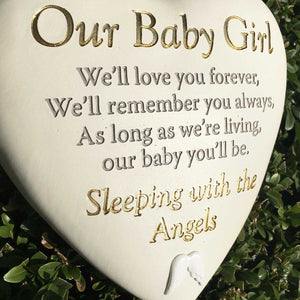 Outdoor Memorial Tribute. White Heart Shaped. Angel Wings Mofit. 'Our Baby Girl'.