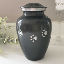 Load image into Gallery viewer, Dog or Cat Cremation Urn, Black with a Diamond Cut Silver Paw Print Pattern