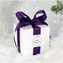 Load image into Gallery viewer, Cubic white “Lovely Keepsake Company” presentation box, with purple ribbon and logo.