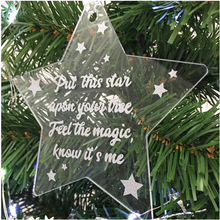 Load image into Gallery viewer, Memorial Christmas Star decoration. Clear acrylic, with text &quot;Put this star upon your tree. Feel  the Magic, Know It&#39;s Me&quot;. Hung on Xmas tree.