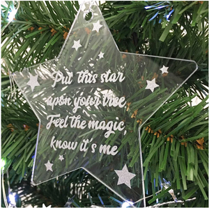 Memorial Christmas Star decoration. Clear acrylic, with text "Put this star upon your tree. Feel  the Magic, Know It's Me". Hung on Xmas tree.