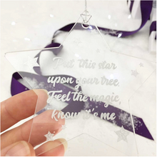 Load image into Gallery viewer, Memorial Christmas Star decoration. Clear acrylic, with text &quot;Put this star upon your tree. Feel  the Magic, Know It&#39;s Me&quot;. Lovely Memorial Gifts white tissue and purple ribbon background.