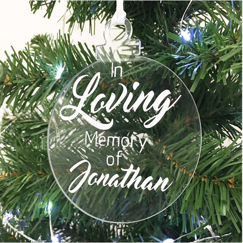 Exclusive to 'The Lovely Gift Group'. A bauble shaped 'In Loving Memory Of' Christmas tree ornament. Clear acrylic with white text.