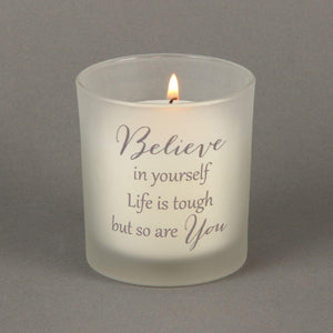 Candle in Glass Holder. Supportive message 'Believe in yourself Life is tough but so are You'. Candle lit.