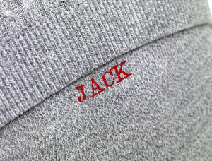 Embroidered name detail on personalised memory cushion.