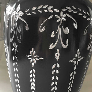 Adult Cremation Urn. Elegant black with silver hanging botancial diamond cut pattern. Close up.